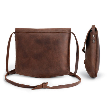 Back view of the Prisma Shoulder Bag from Hide & Drink, emphasizing its minimalist design. This vintage purse is not only a chic accessory but also a functional messenger and crossbody bag crafted from durable full grain leather. Hand cut and hand sewn, it represents the quality and craftsmanship of artisan production in La Antigua Guatemala & Oaxaca Mexico.