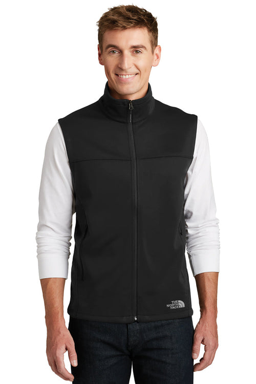 Male model wearing The North Face Ridgeline Soft Shell Vest in black, showcasing full-zip front and sleeveless design.