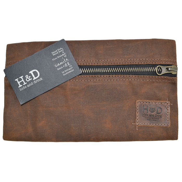 Hide & Drink Utility Cord Pouch highlighted with rich leather touches. Ideal for use as a utility & charger case for MacBook, iPad & Laptop, it functions seamlessly as a cable organizer, showcasing artisan quality from La Antigua Guatemala & Oaxaca Mexico.